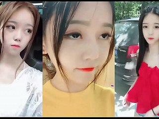 Jonge en leuke Chinees meisje gefilmd een leuke zelfgemaakte neuken cagoule